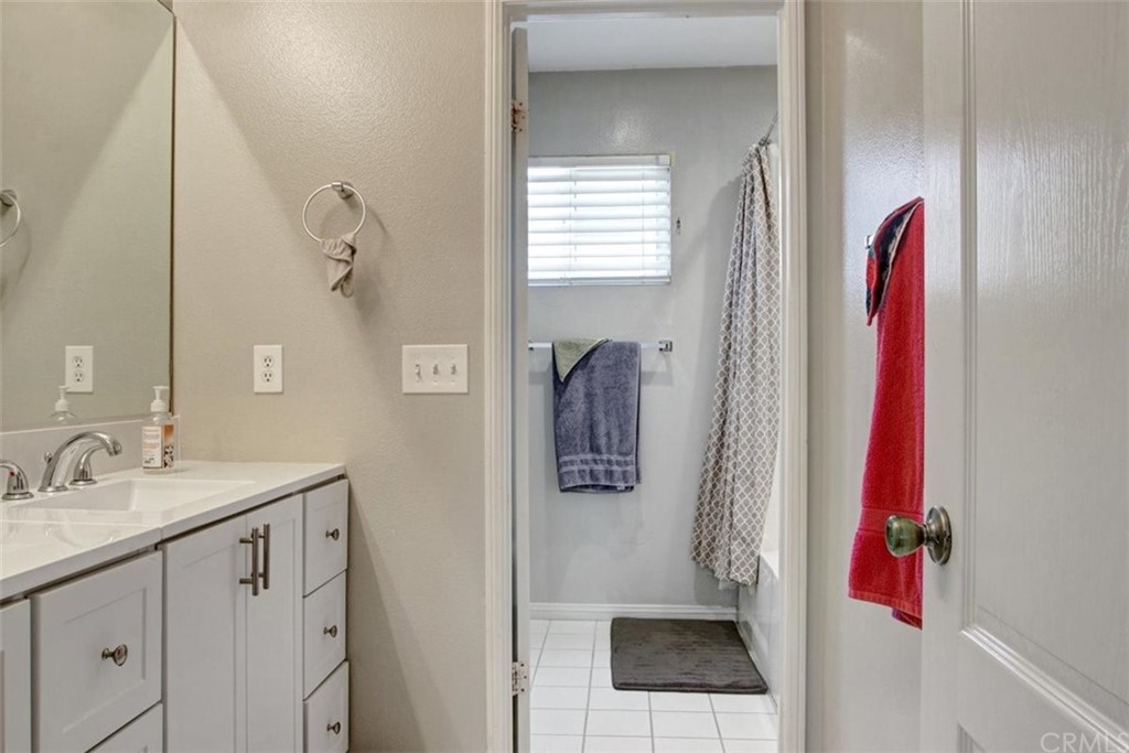 973 Thicket Drive Carson, CA 90746 - Photo 18 of 32 a bathroom with a sink and mirror
