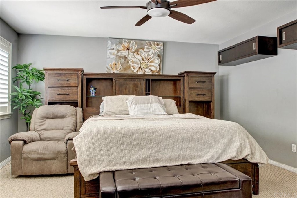 973 Thicket Drive Carson, CA 90746 - Photo 23 of 32 a bedroom with a bed and ceiling fan