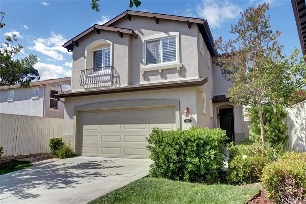 973 Thicket Drive Carson, CA 90746 - Photo 3 of 32 a front view of a house with a yard and garage
