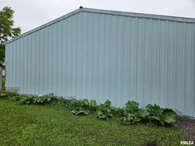 a backyard view with hardwood and garden