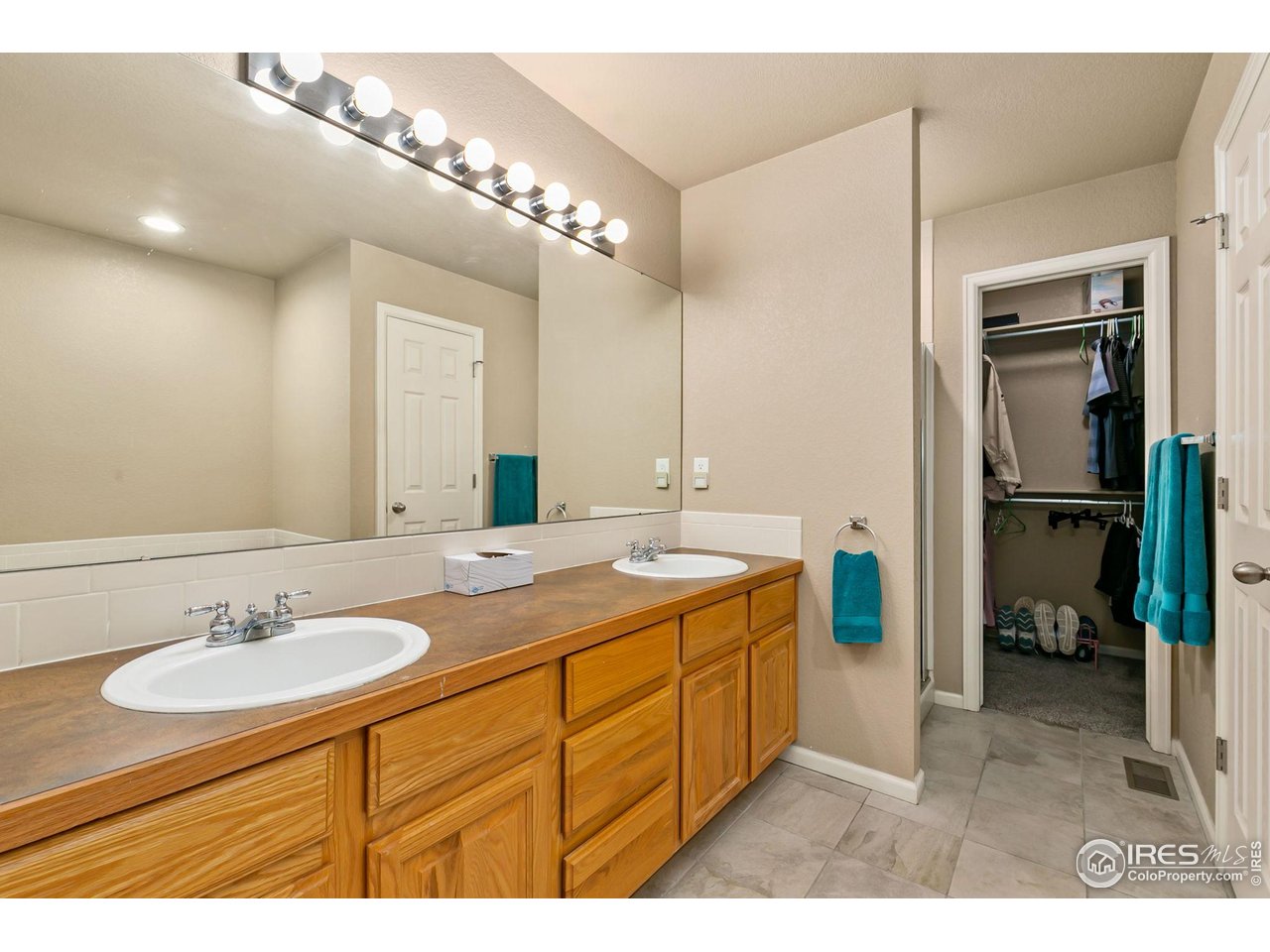 128 Bayside Circle Windsor, CO 80550 - Photo 12 of 24 a bathroom with a sink double vanity and a mirror
