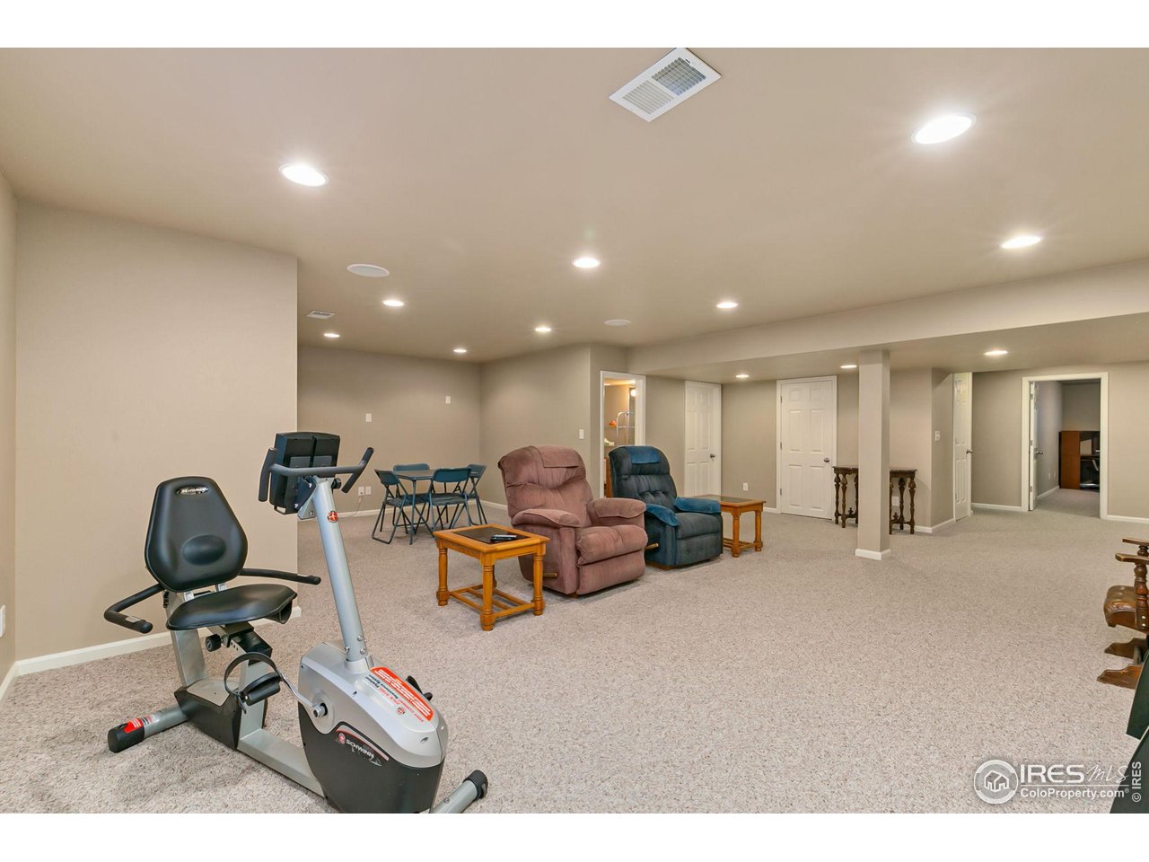 128 Bayside Circle Windsor, CO 80550 - Photo 22 of 24 a view of a room with gym equipment