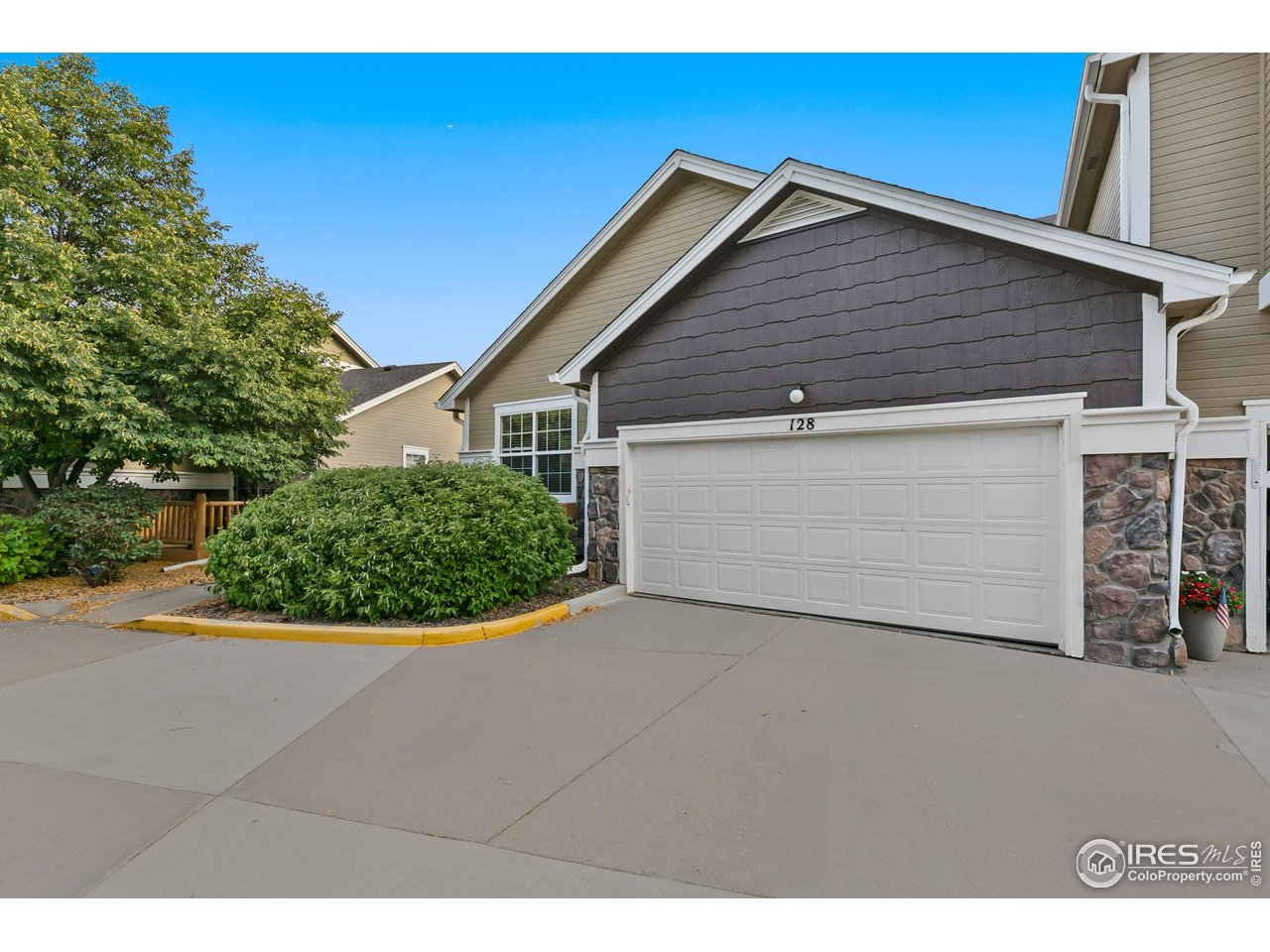 128 Bayside Circle Windsor, CO 80550 - Photo 23 of 24 a view of a house with a garage