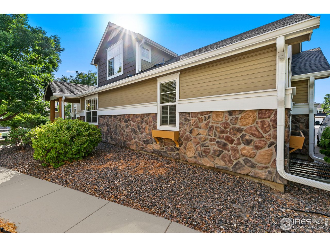 128 Bayside Circle Windsor, CO 80550 - Photo 3 of 24 a view of a house with wooden fence