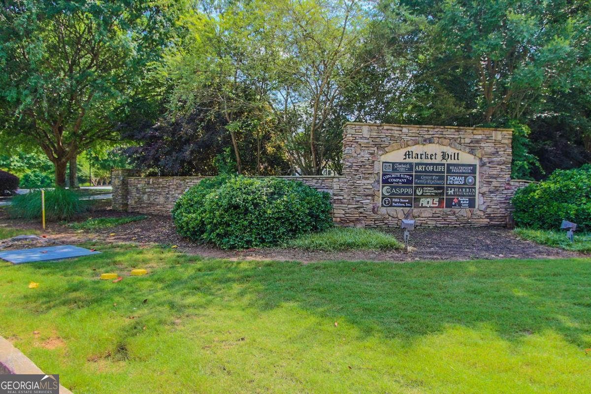 180 Greencastle Road Tyrone, GA 30290 - Photo 8 of 9 a view of a backyard with plants and large trees