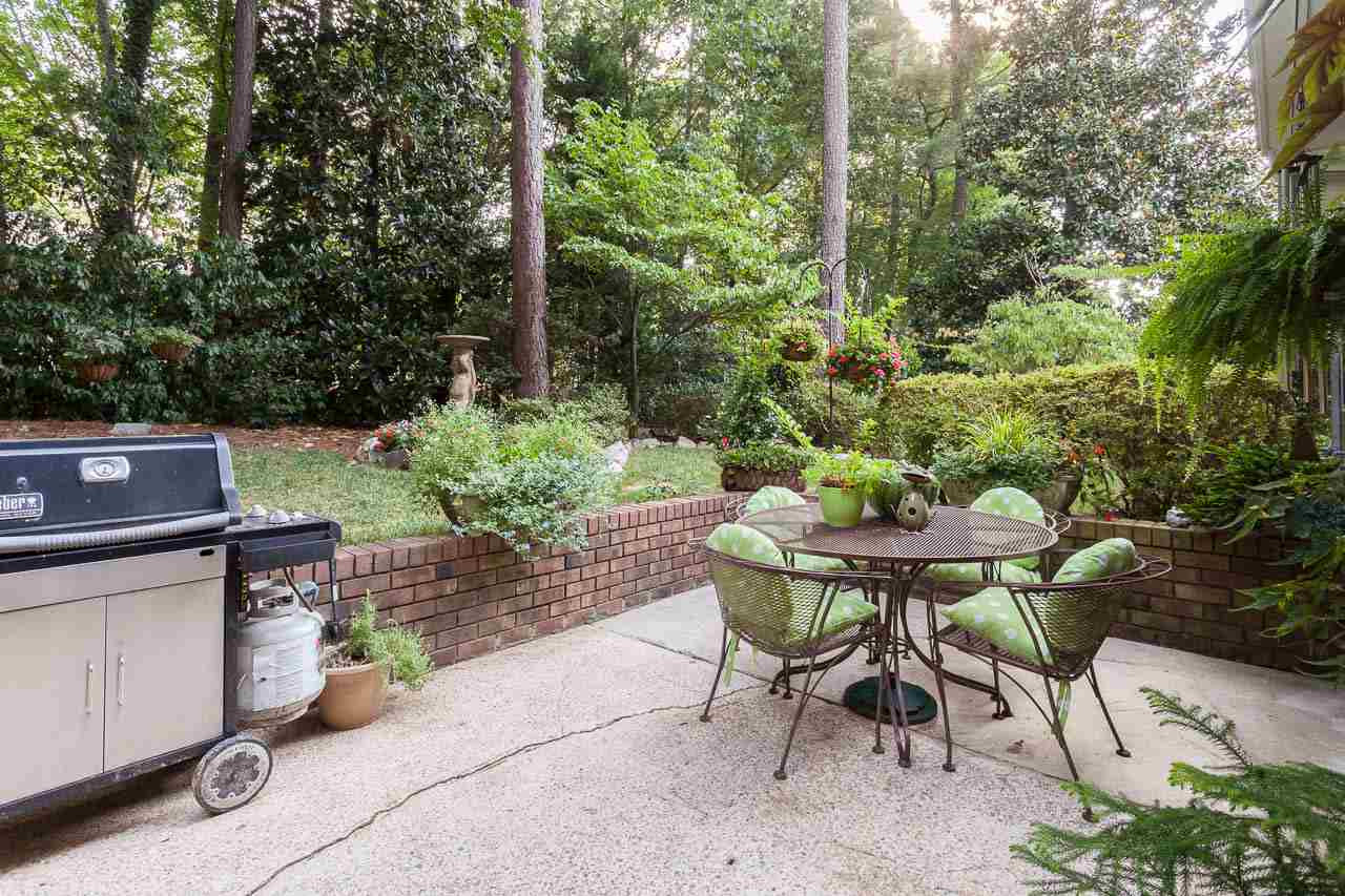 1301 Sadler Court Raleigh, NC 27615 - Photo 5 of 21 SPACIOUS PATIOS PERFECT FOR ENTERTAINING OR JUST ENJOYING THE SERENE VIEW. Exterior Back