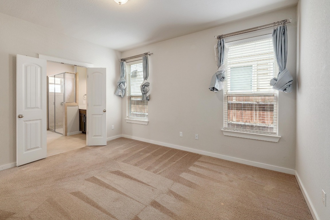 16233 Travesia Way Austin, TX 78728 - Photo 12 of 27 a view of an empty room with window and closet area