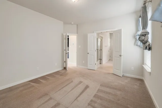 a bathroom with a double vanity sink and mirror with shower