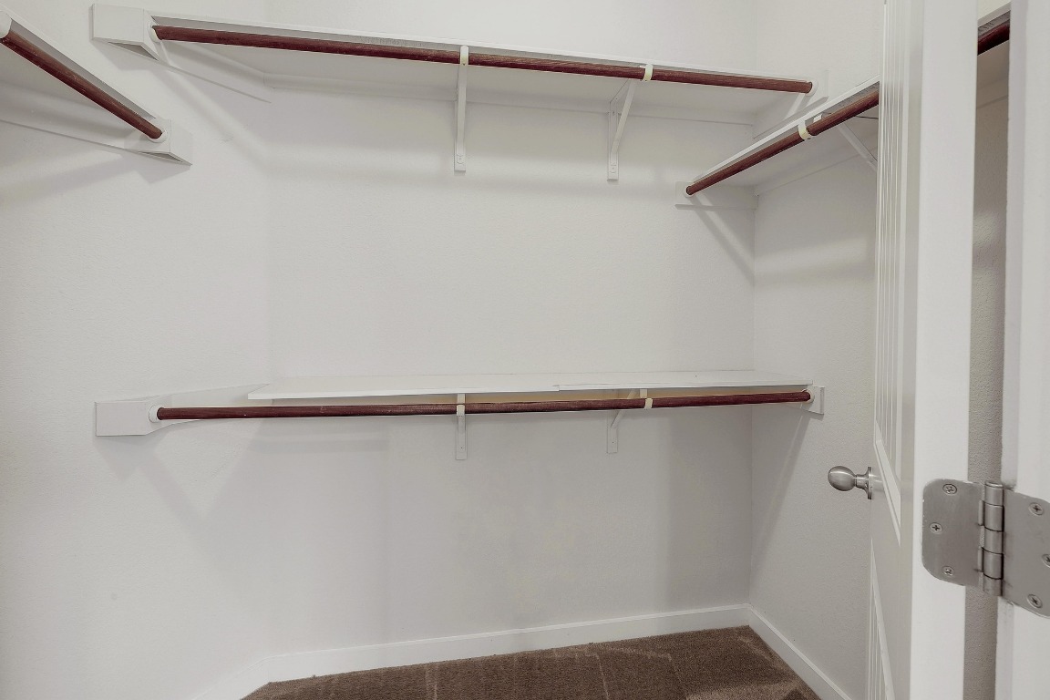 16233 Travesia Way Austin, TX 78728 - Photo 16 of 27 a view of small space with racks on the wall