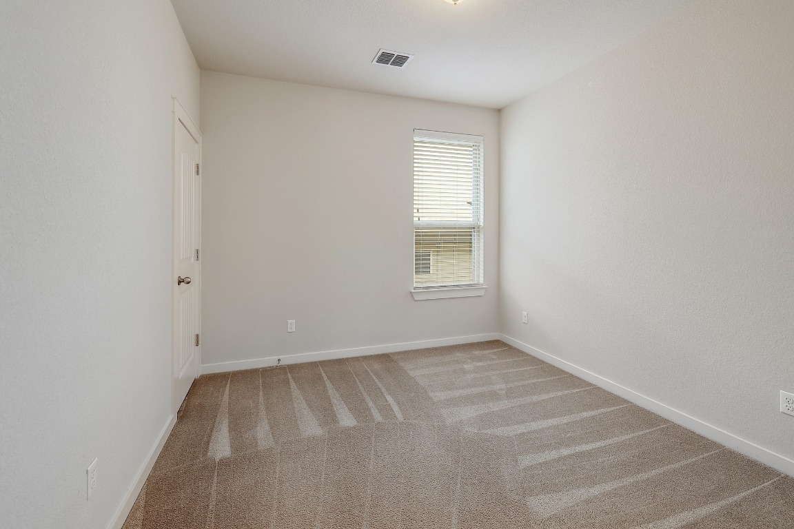 16233 Travesia Way Austin, TX 78728 - Photo 19 of 27 an empty room with a window