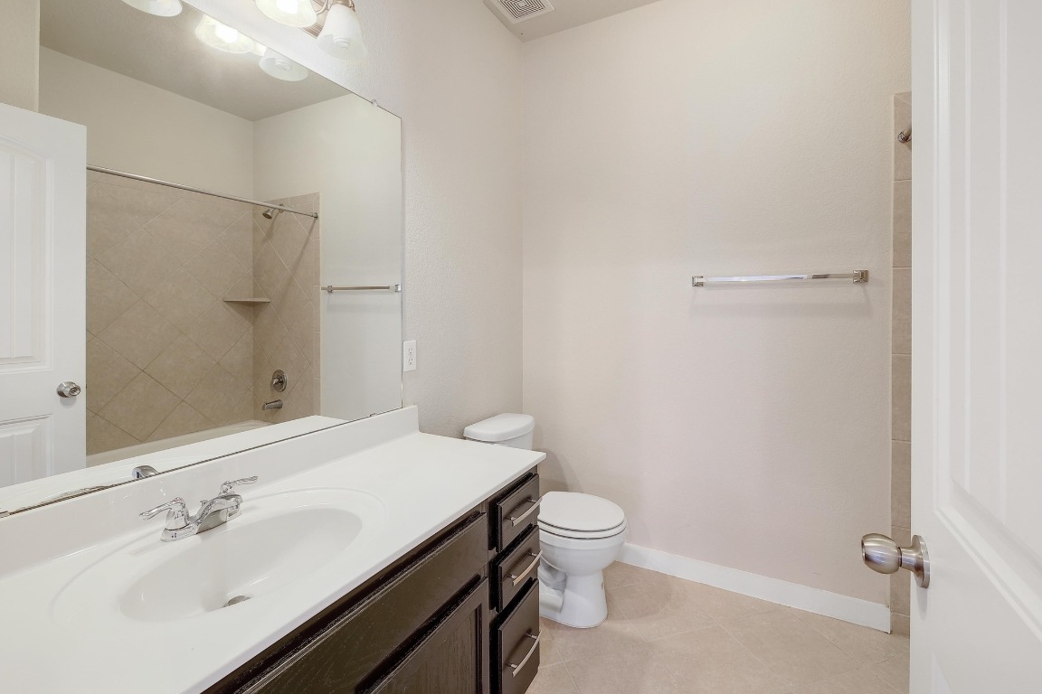 16233 Travesia Way Austin, TX 78728 - Photo 21 of 27 a bathroom with a sink toilet and shower