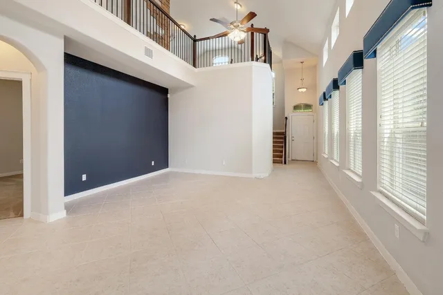 a view of a big room with closet and windows