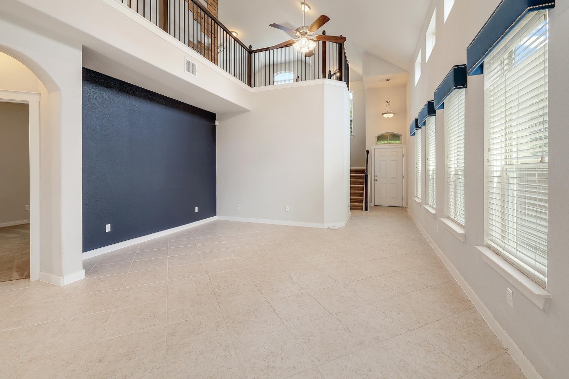16233 Travesia Way Austin, TX 78728 - Photo 6 of 27 a view of a big room with closet and windows