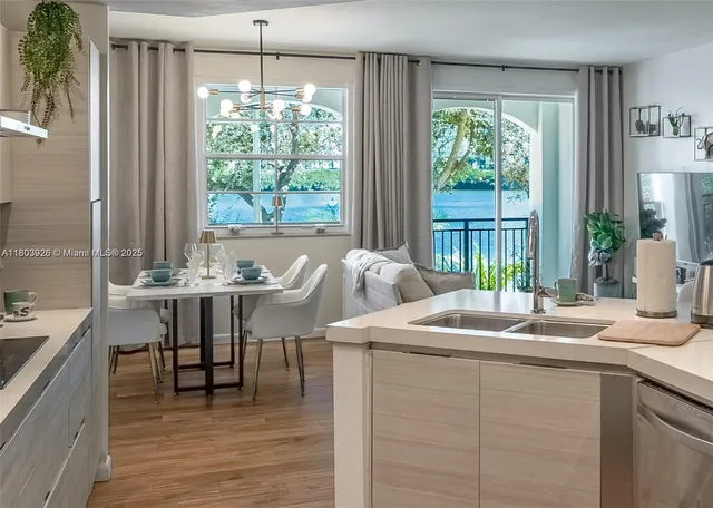 a dining table with chairs and window