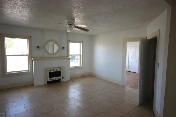 a kitchen with a sink a stove and cabinets