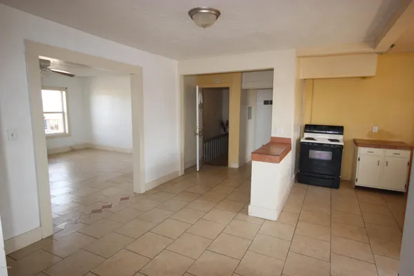 a kitchen with stainless steel appliances granite countertop a sink and a refrigerator