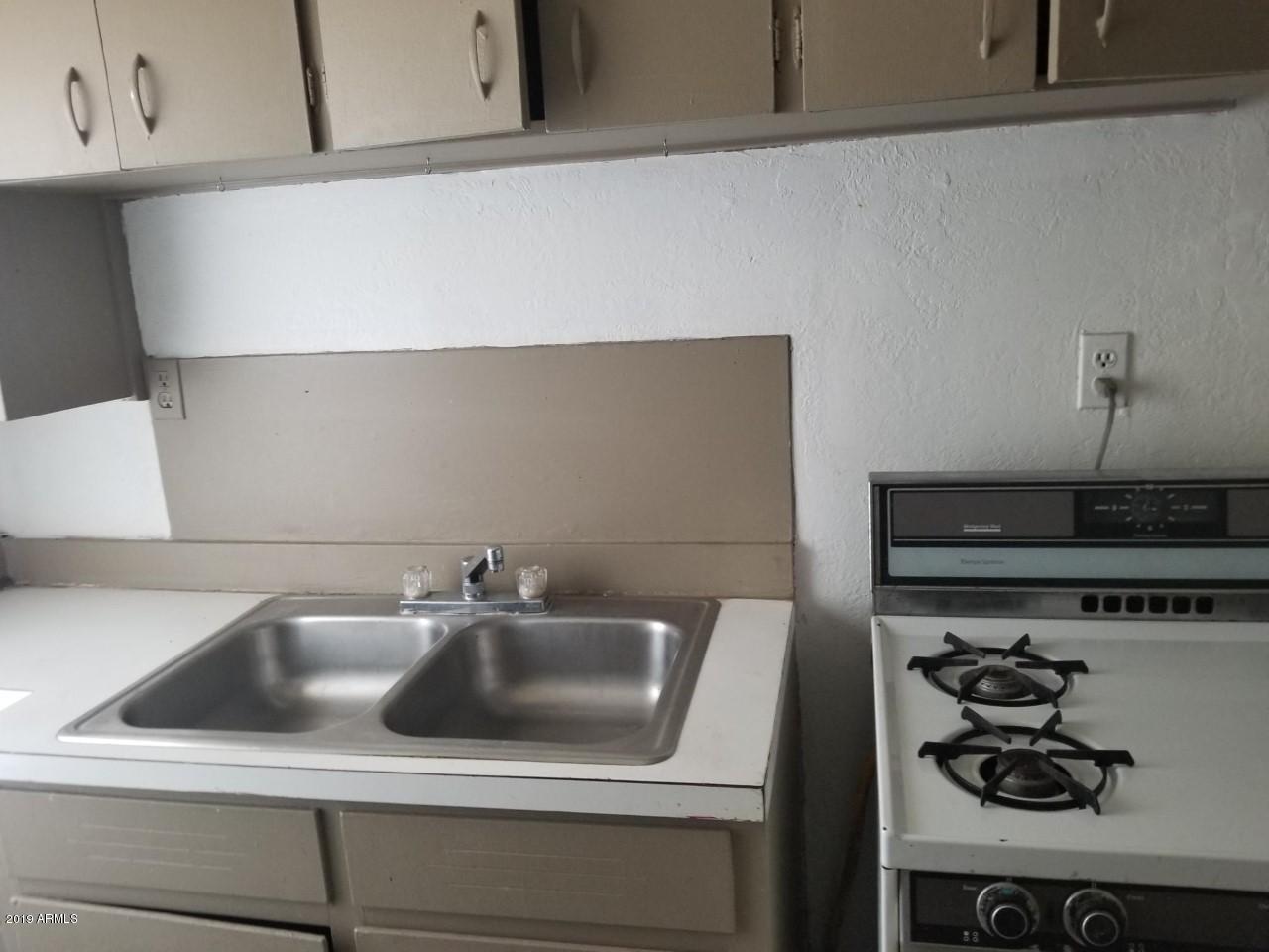 1165 East 10th Street Douglas, AZ 85607 - Photo 18 of 54 a close view of sink and cabinets