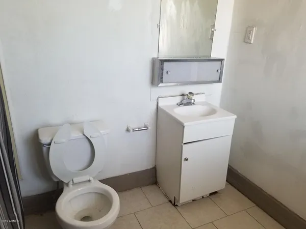 a kitchen with a stove and a refrigerator