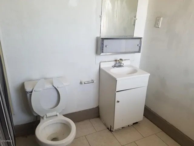 a kitchen with a stove and a refrigerator