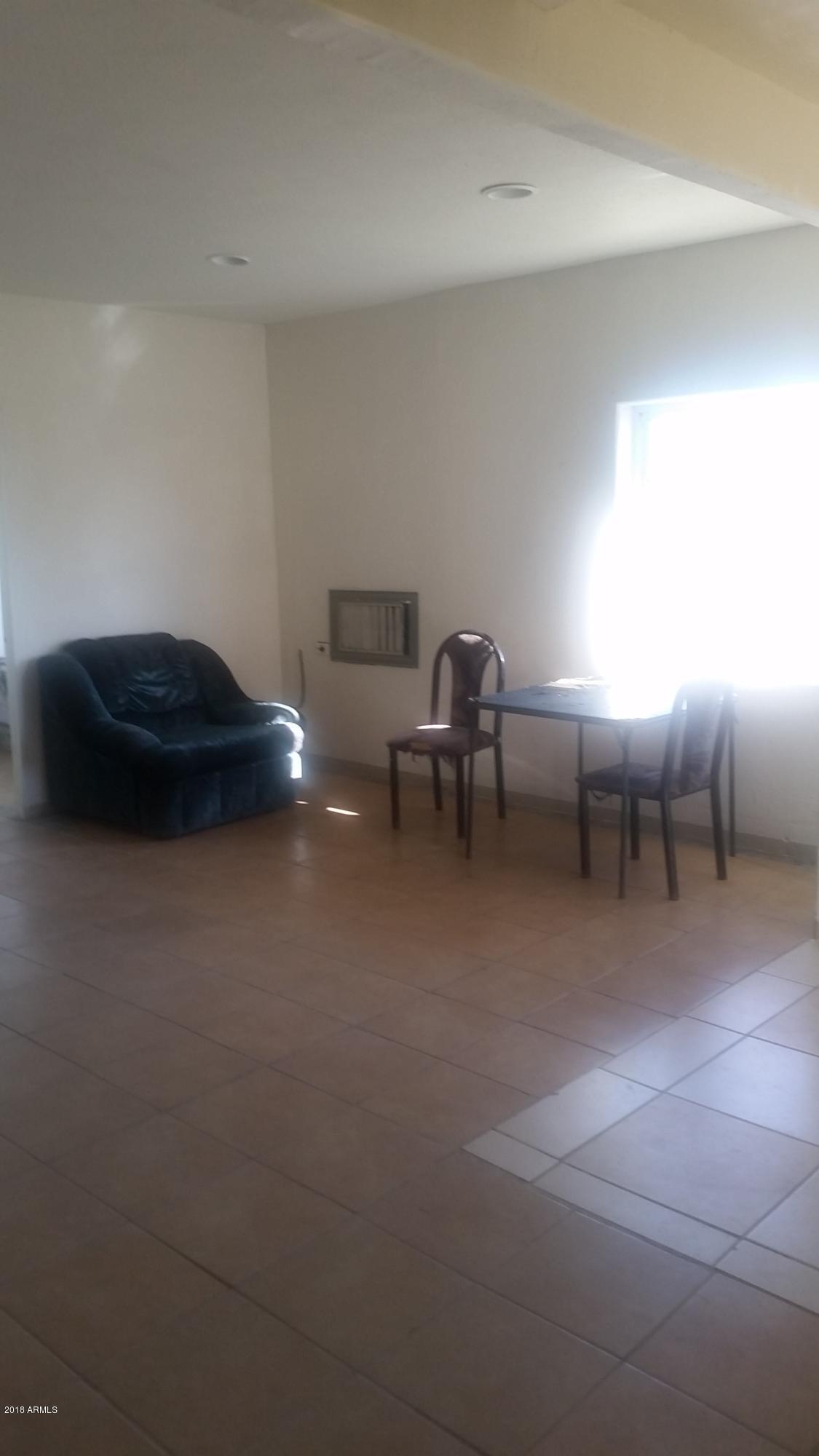 1165 East 10th Street Douglas, AZ 85607 - Photo 24 of 54 a living room with furniture and a table