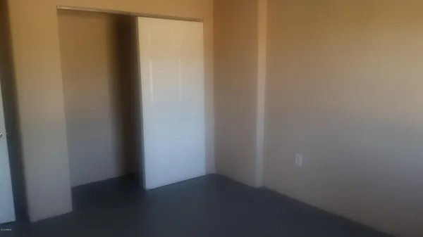 a view of a storage and utility room with washer and dryer