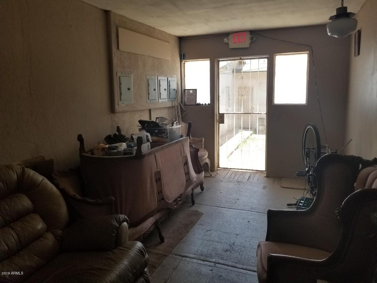 1165 East 10th Street Douglas, AZ 85607 - Photo 34 of 54 a living room with furniture and a large window