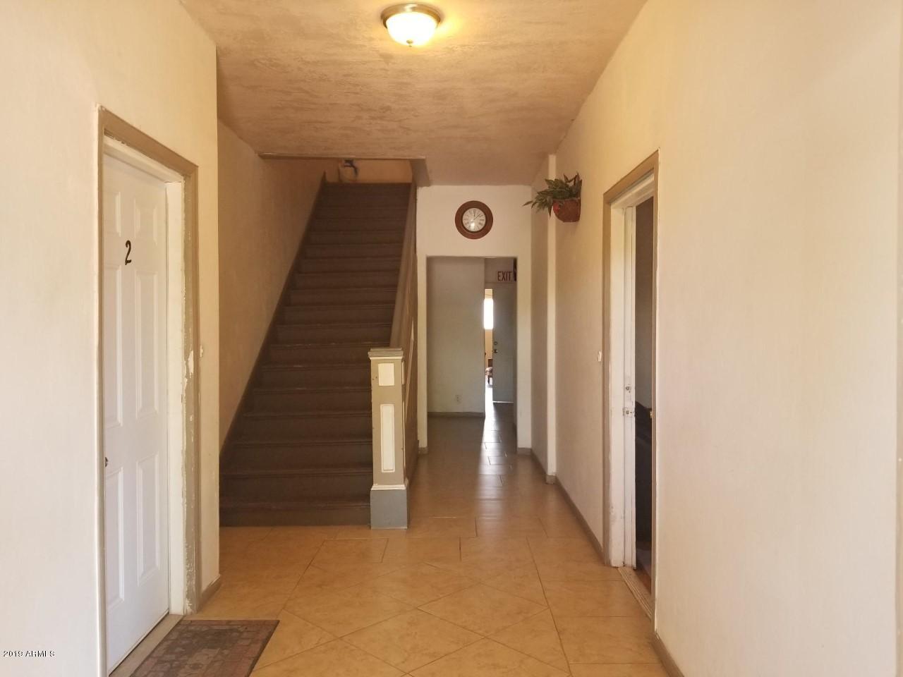 1165 East 10th Street Douglas, AZ 85607 - Photo 4 of 54 a view of a hallway with wooden floor and entryway
