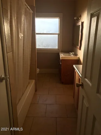 a view of a hallway view with staircase