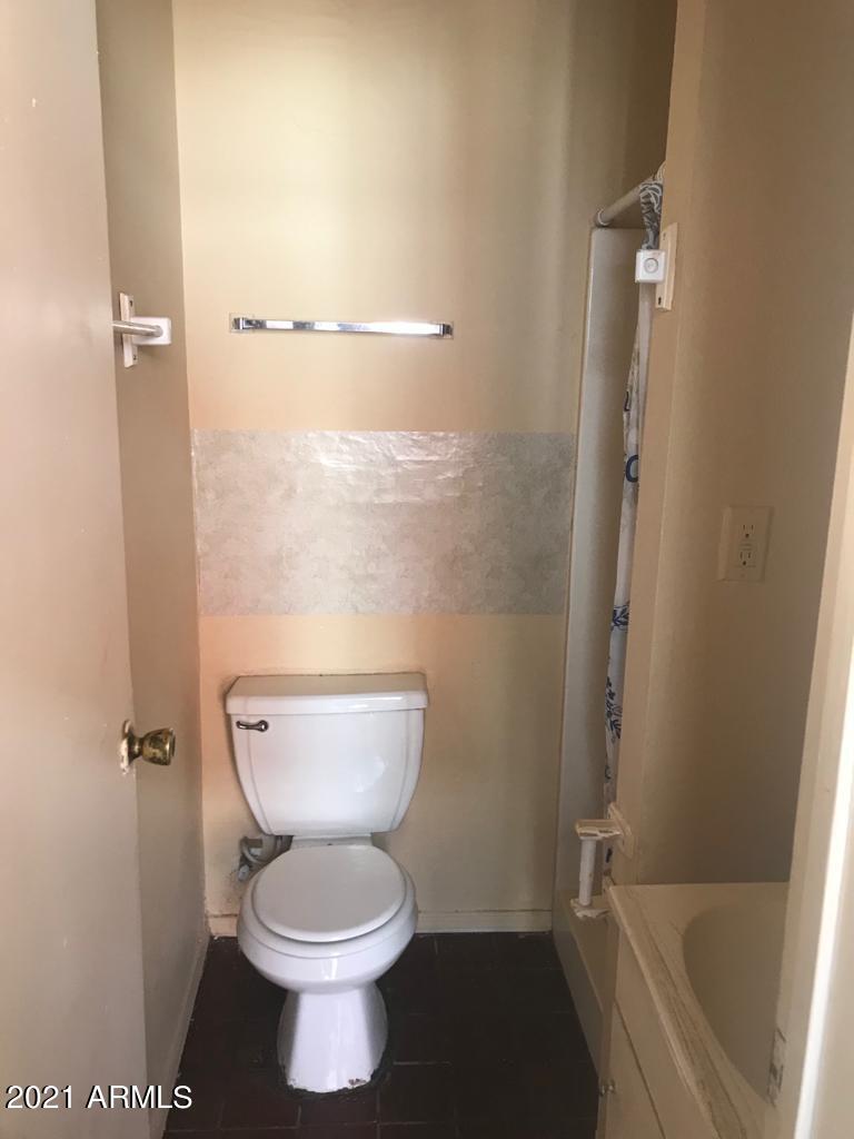 1165 East 10th Street Douglas, AZ 85607 - Photo 50 of 54 a bathroom with a toilet and a shower