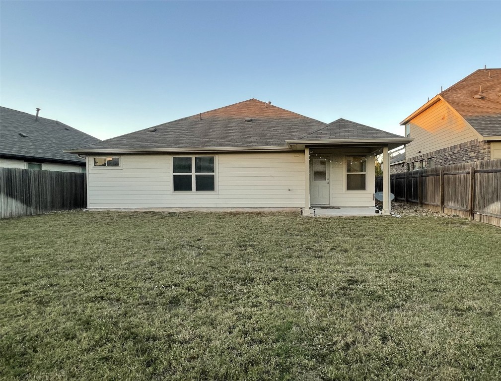 308 Somerville Street Leander, TX 78641 - Photo 15 of 24 Rear view of house with a patio, a fenced backyard, and a shingled roof