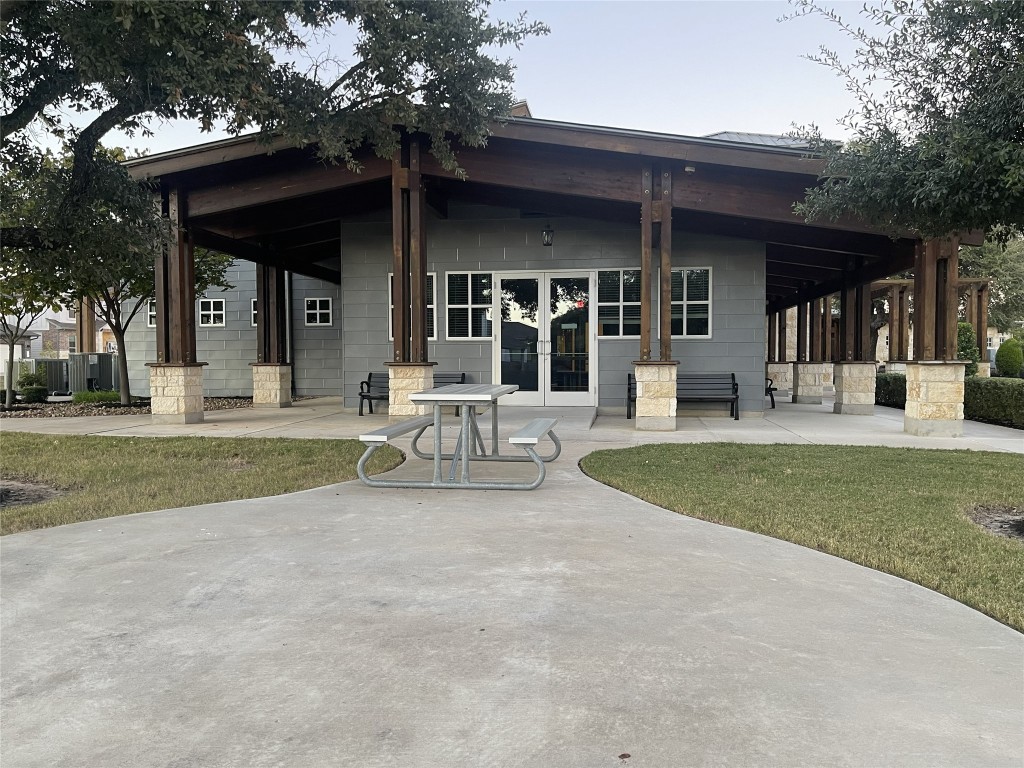 308 Somerville Street Leander, TX 78641 - Photo 24 of 24 Rear view of house with a patio and a lawn