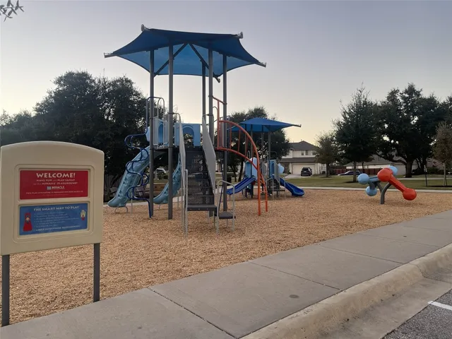 a view of a park with a slide