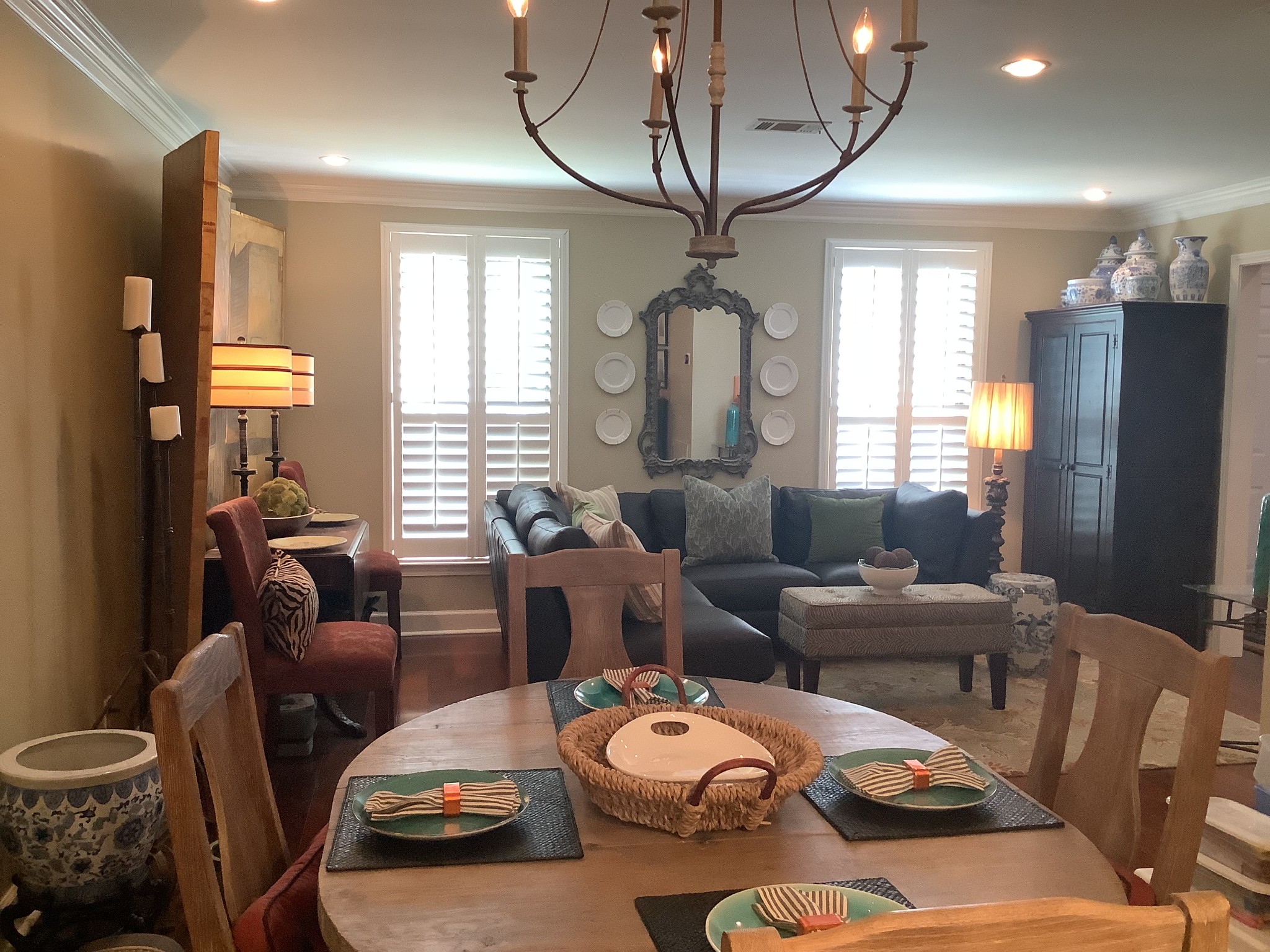 1033 General George Patton Road Nashville, TN 37221 - Photo 5 of 24 a living room with furniture a chandelier and a large mirror