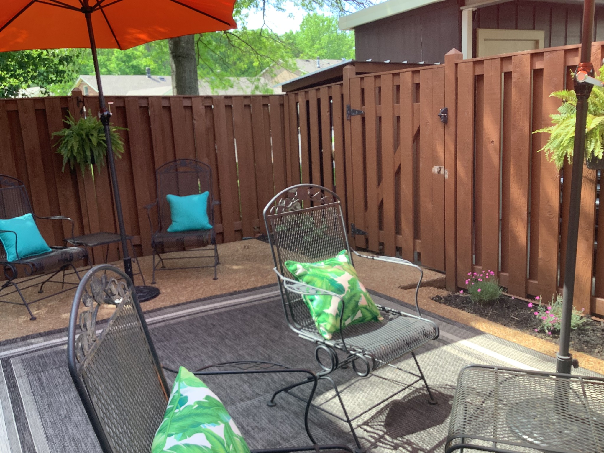 1033 General George Patton Road Nashville, TN 37221 - Photo 8 of 24 a table and chairs in the patio with potted plants