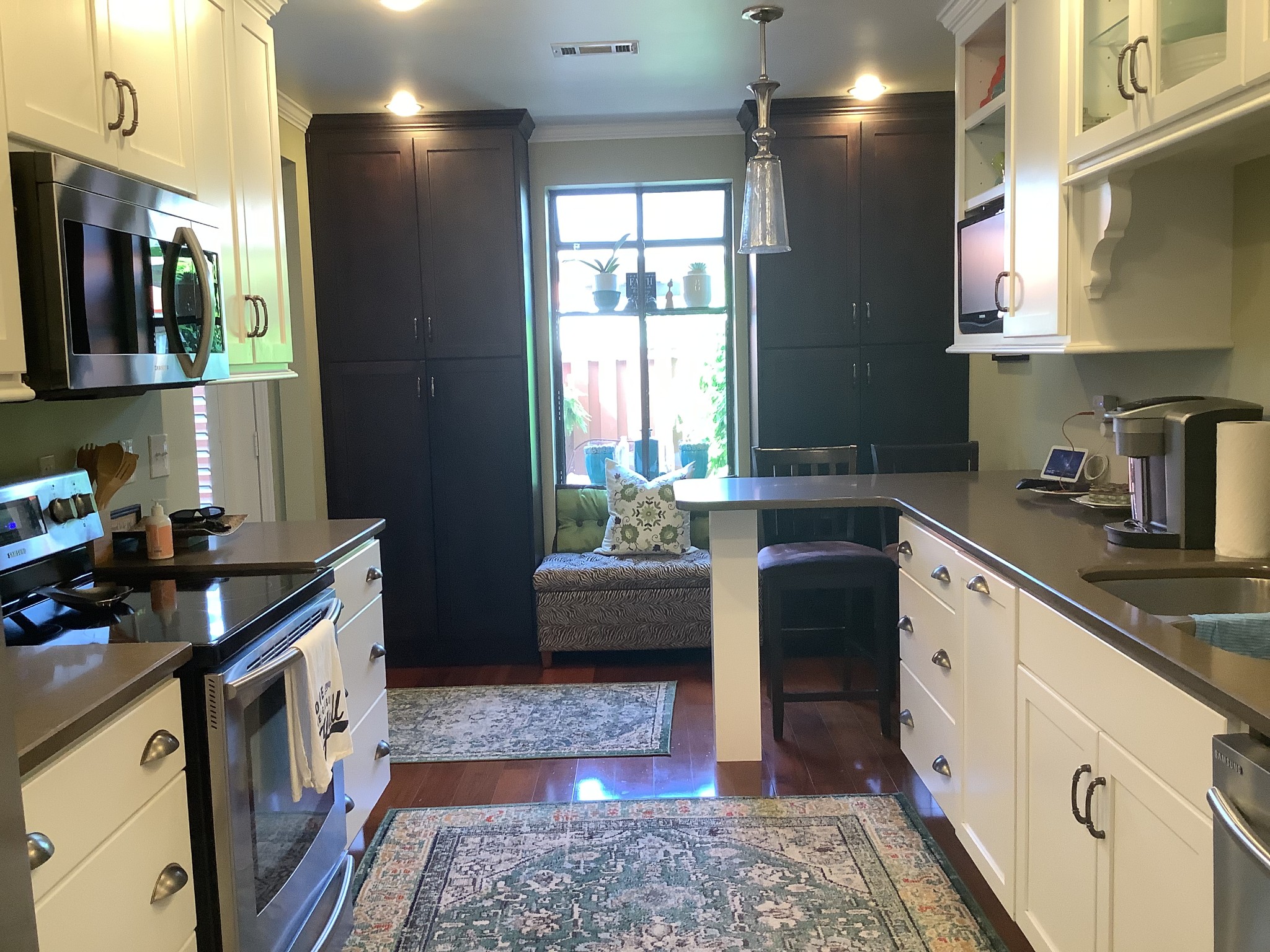 1033 General George Patton Road Nashville, TN 37221 - Photo 10 of 24 a kitchen with stainless steel appliances granite countertop a sink stove and refrigerator