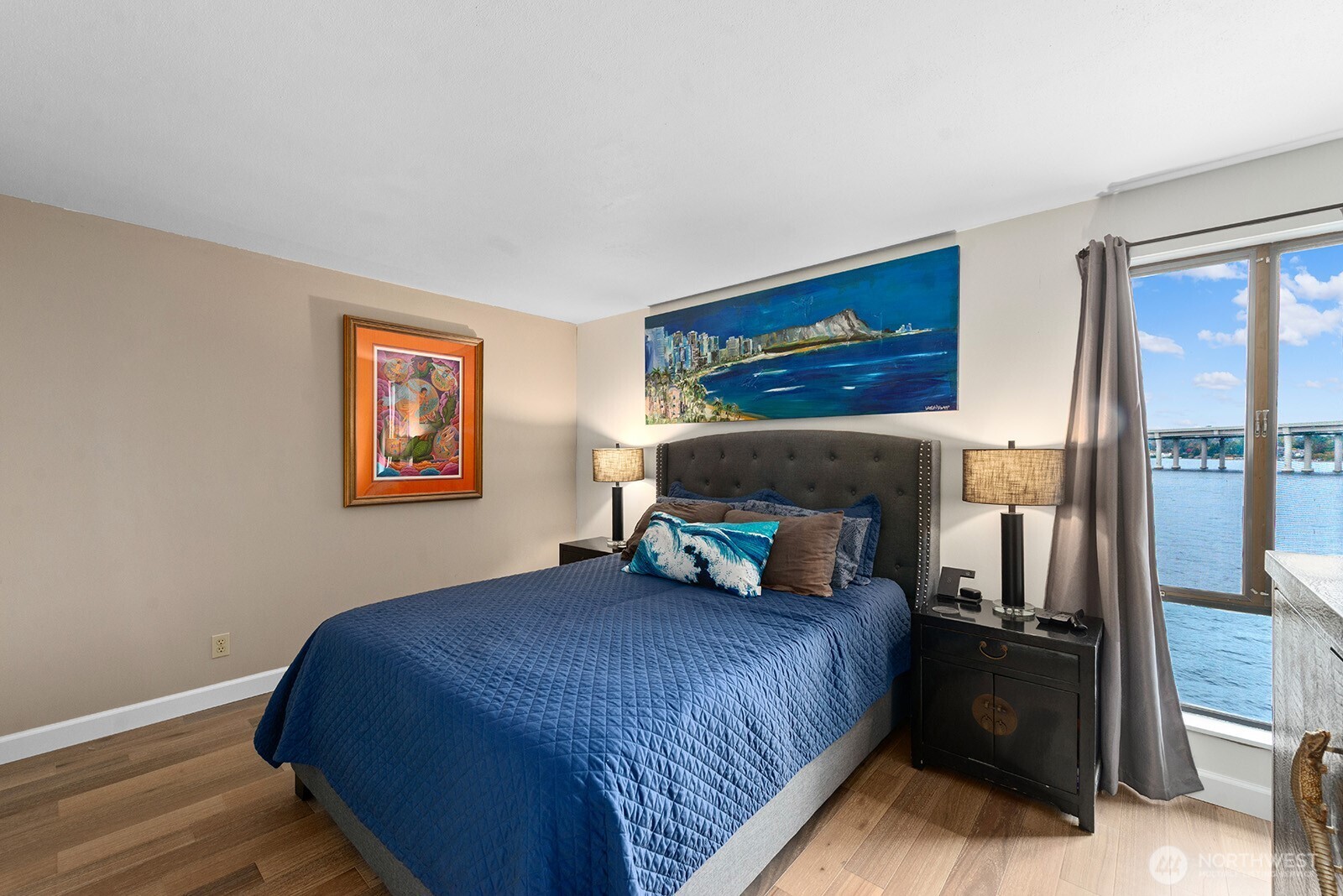 2360 43rd Avenue East, Unit 214 Seattle, WA 98112 - Photo 16 of 34 a bedroom with a bed and a painting on the wall