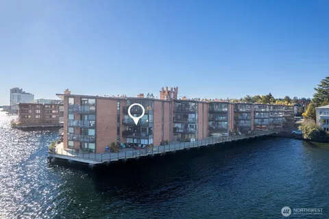 a view of a roof with sitting area