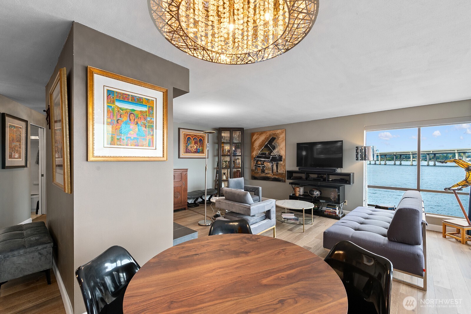 2360 43rd Avenue East, Unit 214 Seattle, WA 98112 - Photo 3 of 34 a bedroom with furniture and a flat screen tv