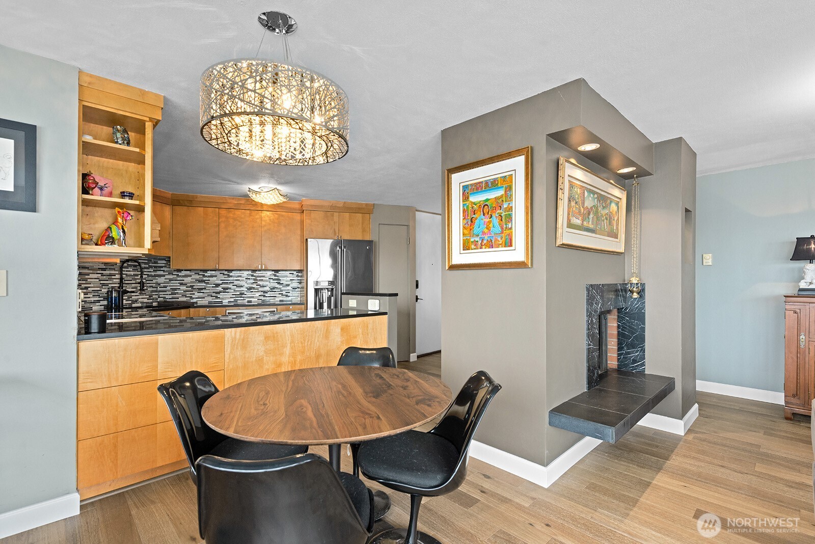 2360 43rd Avenue East, Unit 214 Seattle, WA 98112 - Photo 8 of 34 a view of a dining room with furniture and wooden floor