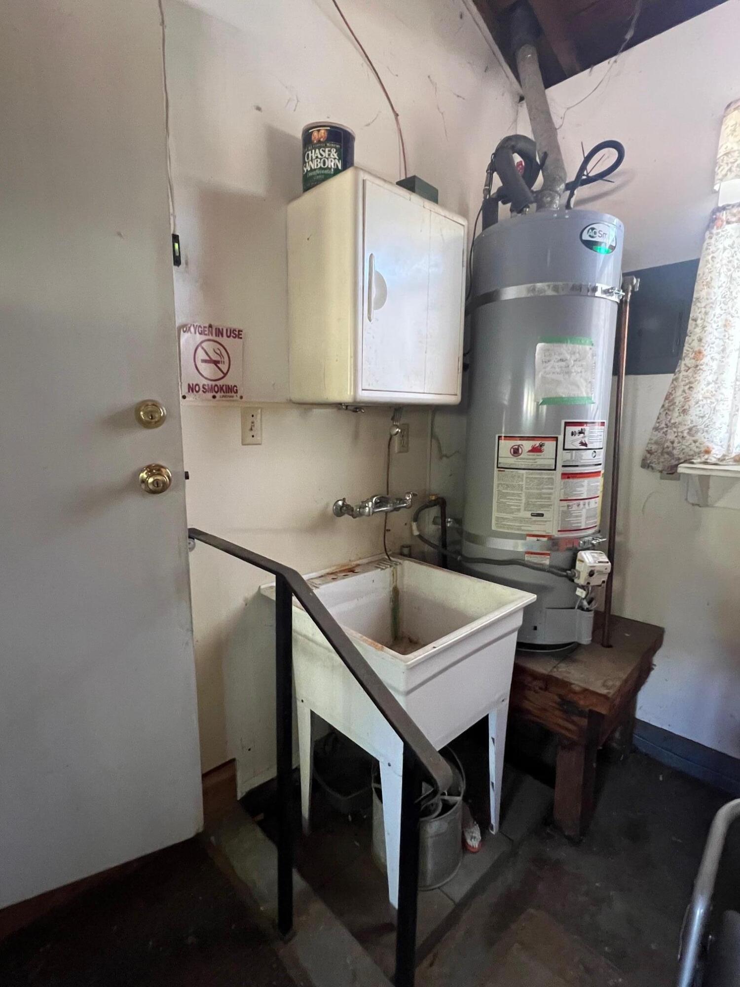 2041 Comet Street Redding, CA 96002 - Photo 16 of 16 a kitchen with a sink cabinets and wooden floor
