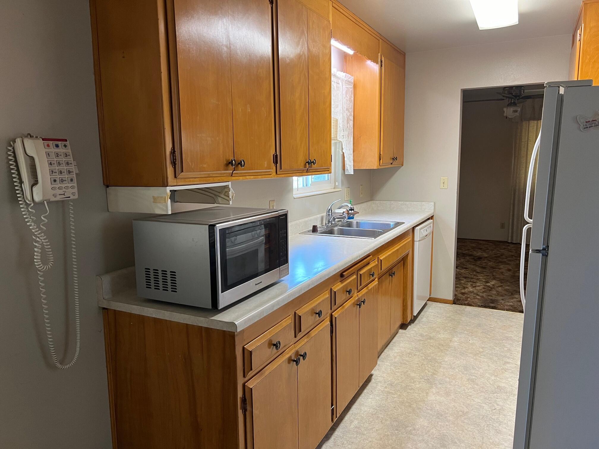 2041 Comet Street Redding, CA 96002 - Photo 2 of 16 a kitchen with stainless steel appliances granite countertop a sink stove and refrigerator
