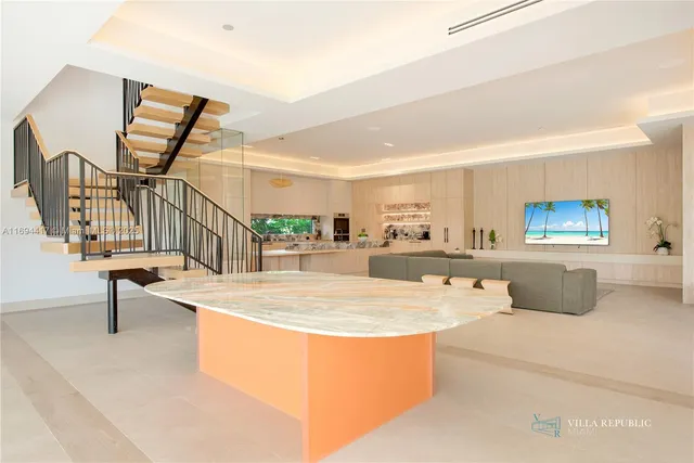 a view of living room with furniture and a flat screen tv
