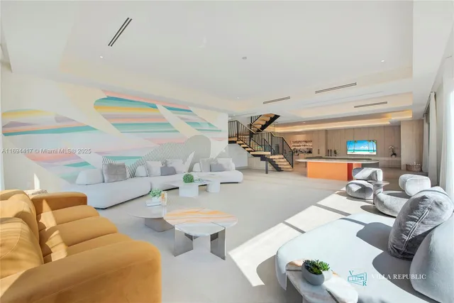 a living room with furniture and a table