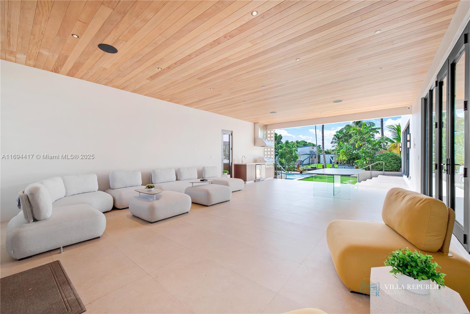 1200 Northeast 87th Street Miami, FL 33138 - Photo 2 of 58 a living room with furniture and a large window