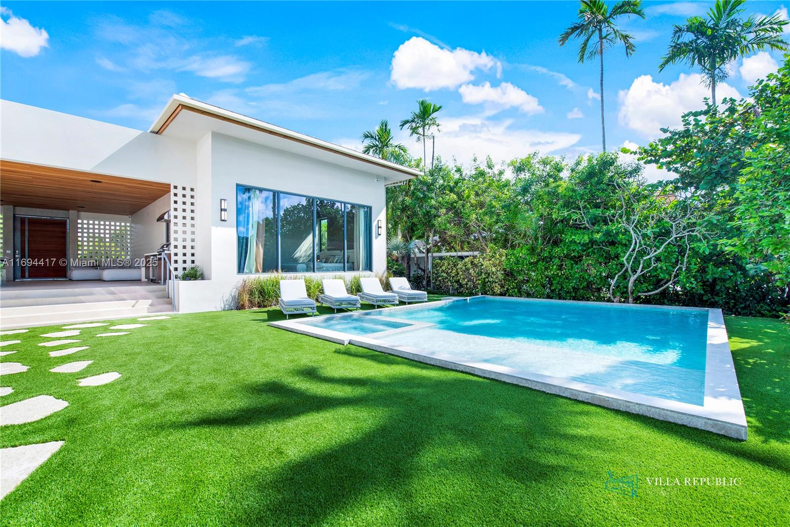1200 Northeast 87th Street Miami, FL 33138 - Photo 23 of 58 a view of a house with a backyard porch and sitting area