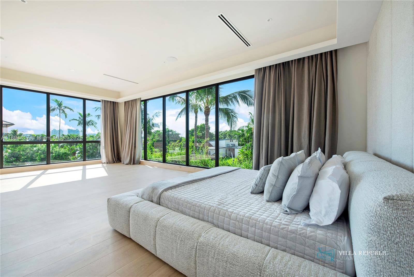 1200 Northeast 87th Street Miami, FL 33138 - Photo 27 of 58 a bed sitting in a bedroom next to a window