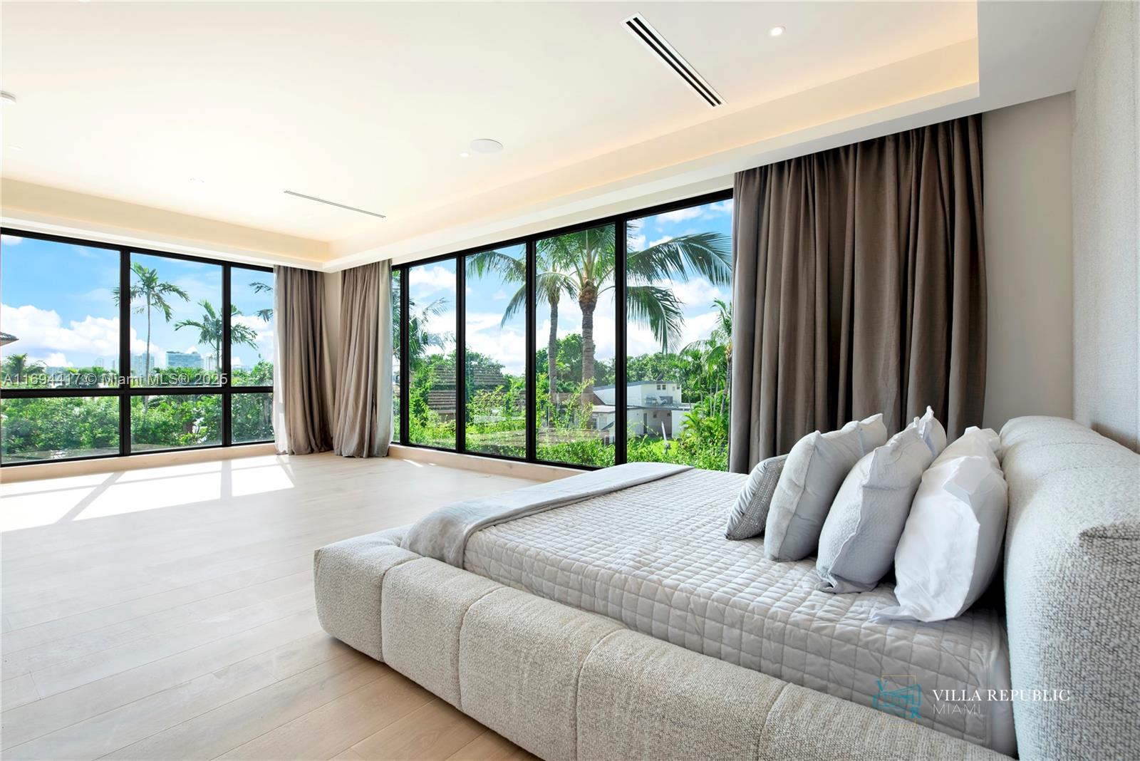 1200 Northeast 87th Street Miami, FL 33138 - Photo 28 of 58 a bed sitting in a bedroom next to a window