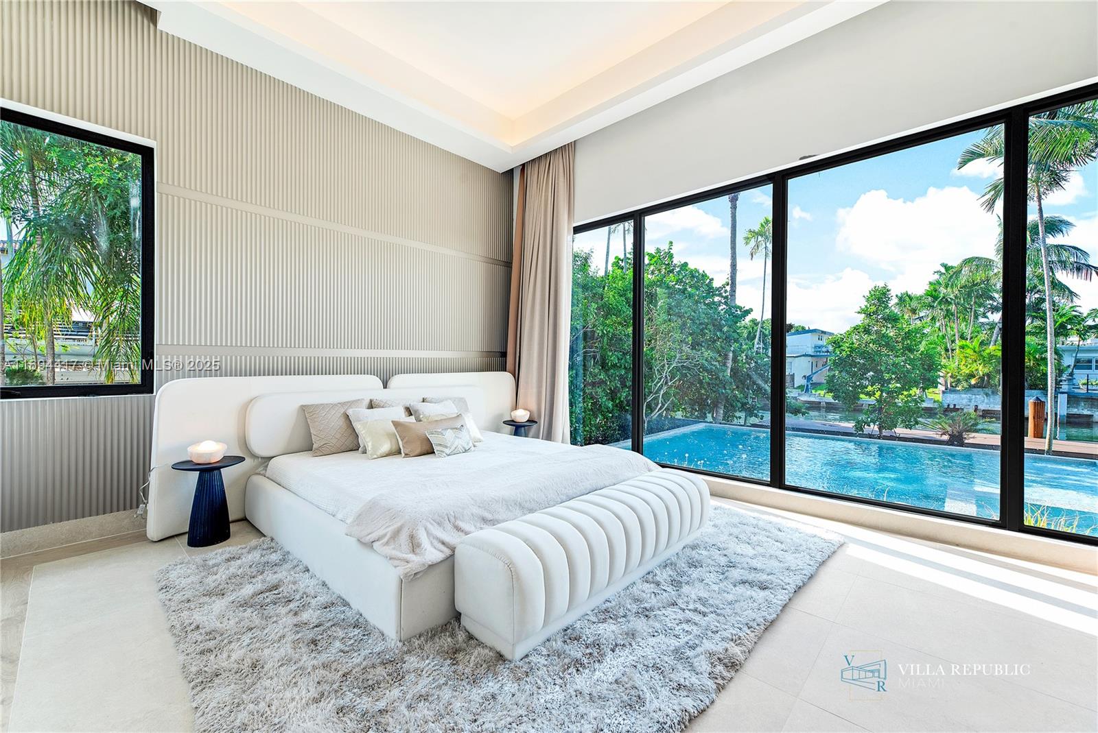 1200 Northeast 87th Street Miami, FL 33138 - Photo 30 of 58 a bedroom with a large bed and a large window