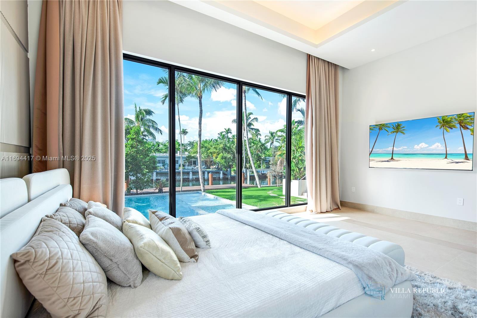 1200 Northeast 87th Street Miami, FL 33138 - Photo 32 of 58 a bedroom with a bed and a large window