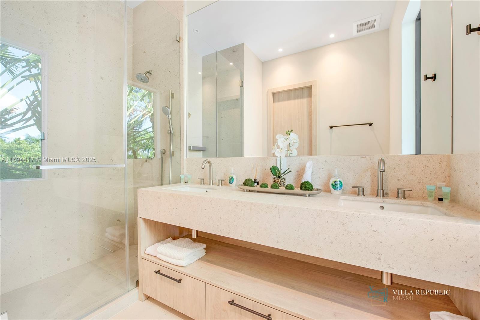 1200 Northeast 87th Street Miami, FL 33138 - Photo 34 of 58 a bathroom with a sink and a mirror